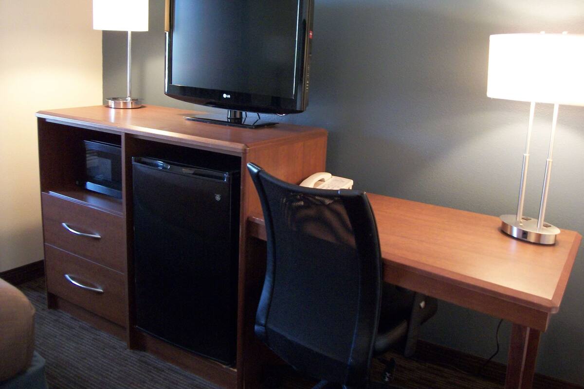 desk, blackout curtains, iron/ironing board, rollaway beds