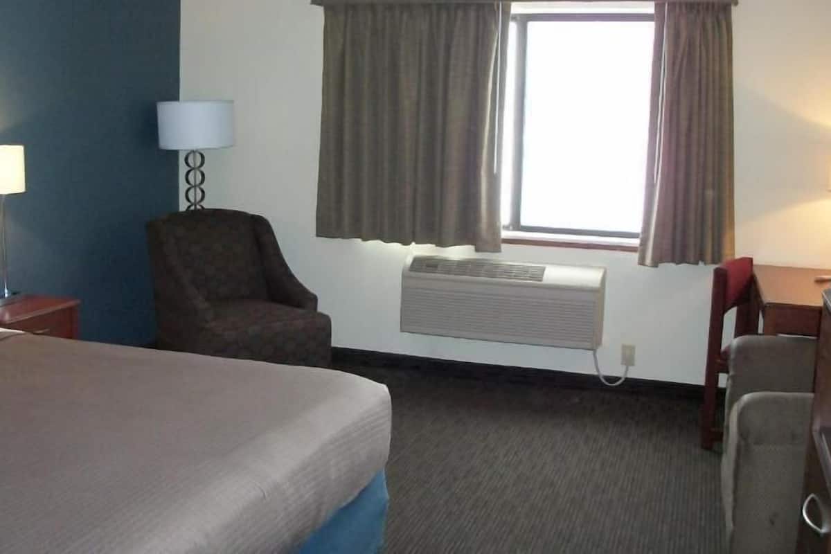 Desk, blackout drapes, iron/ironing board, rollaway beds