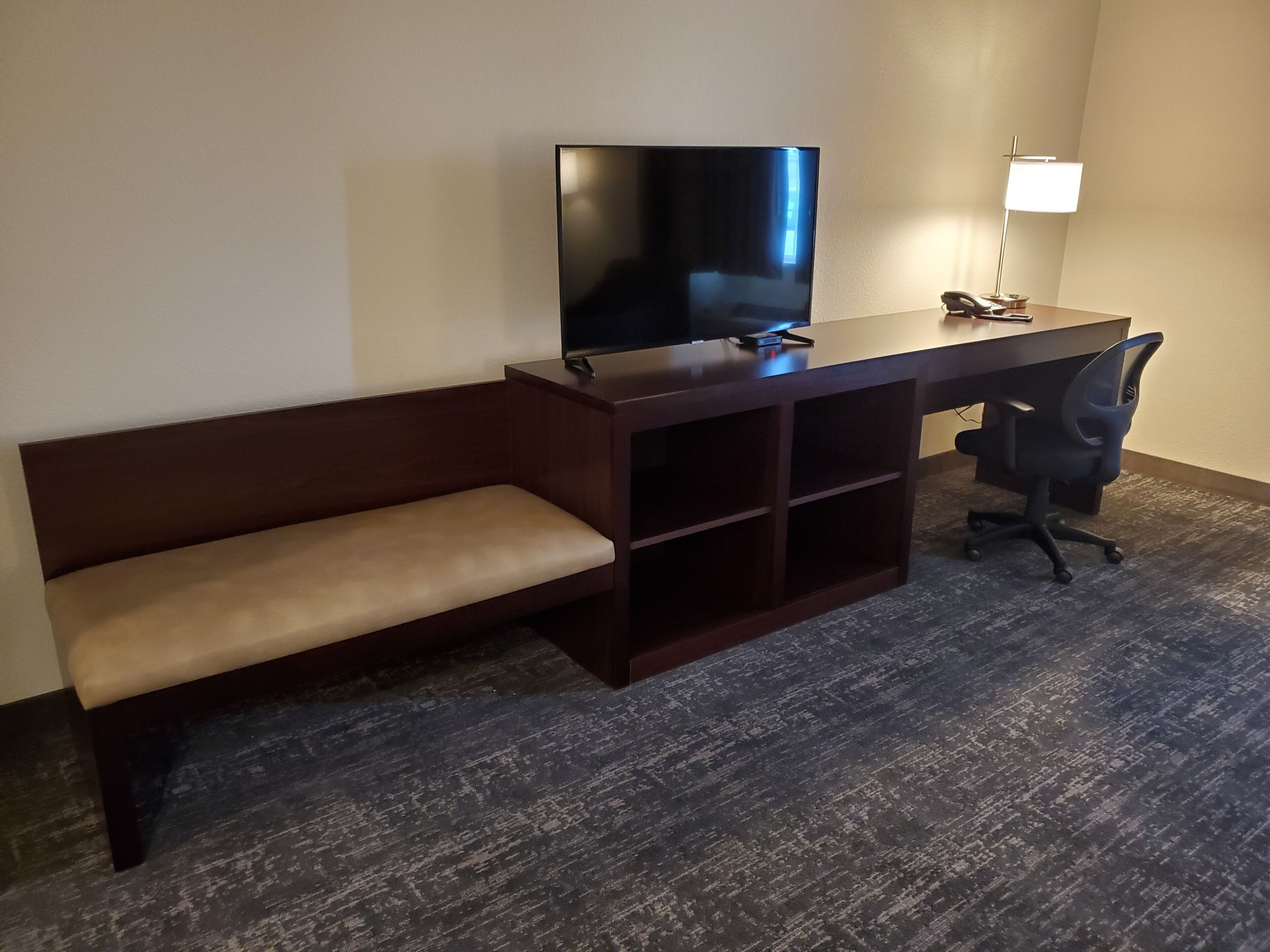 premium bedding, pillow-top beds, desk, laptop workspace