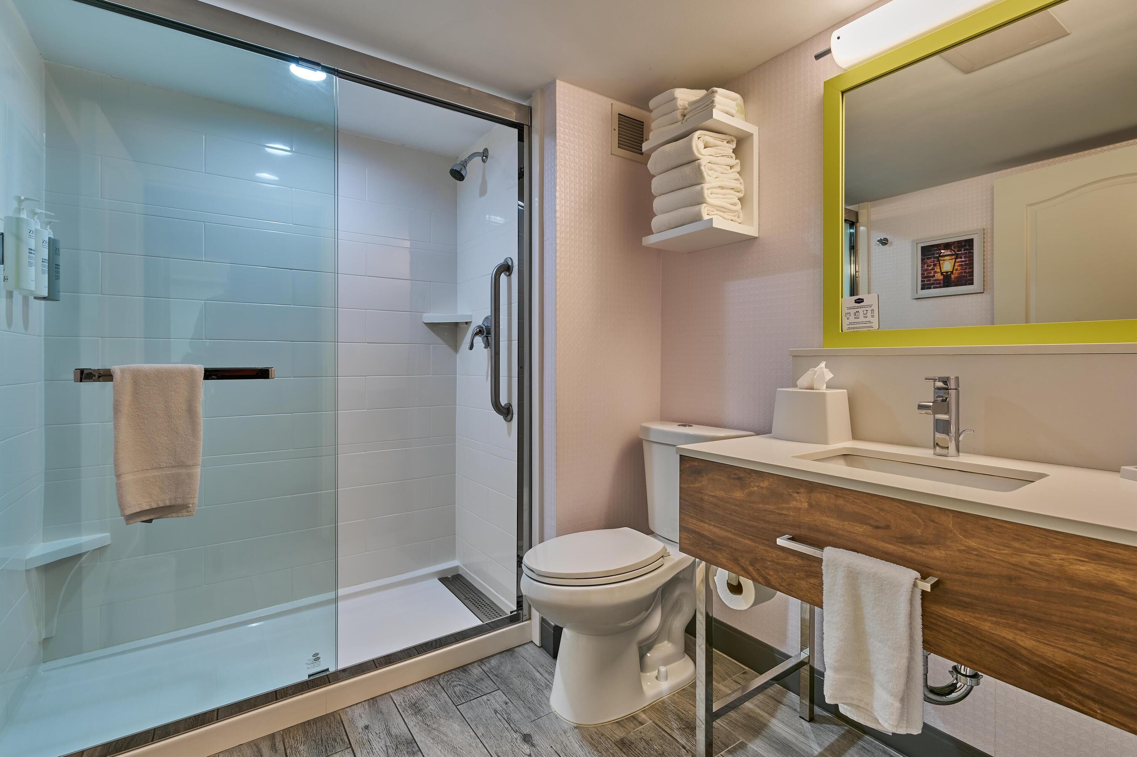 room, 2 queen beds, refrigerator & microwave | bathroom shower