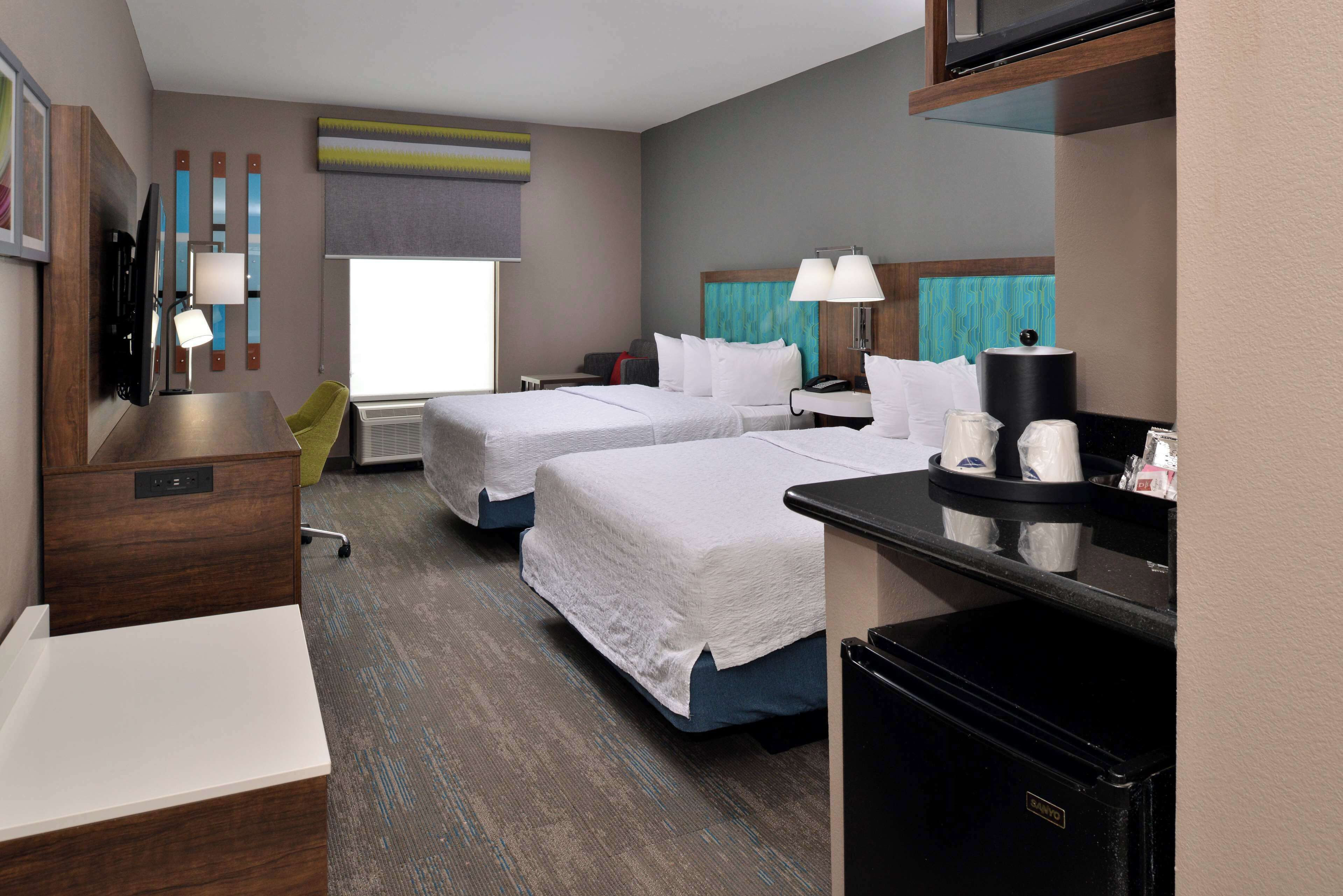 room, 2 queen beds, refrigerator & microwave | 1 bedroom, in-room safe, iron/ironing board, free cots/infant beds