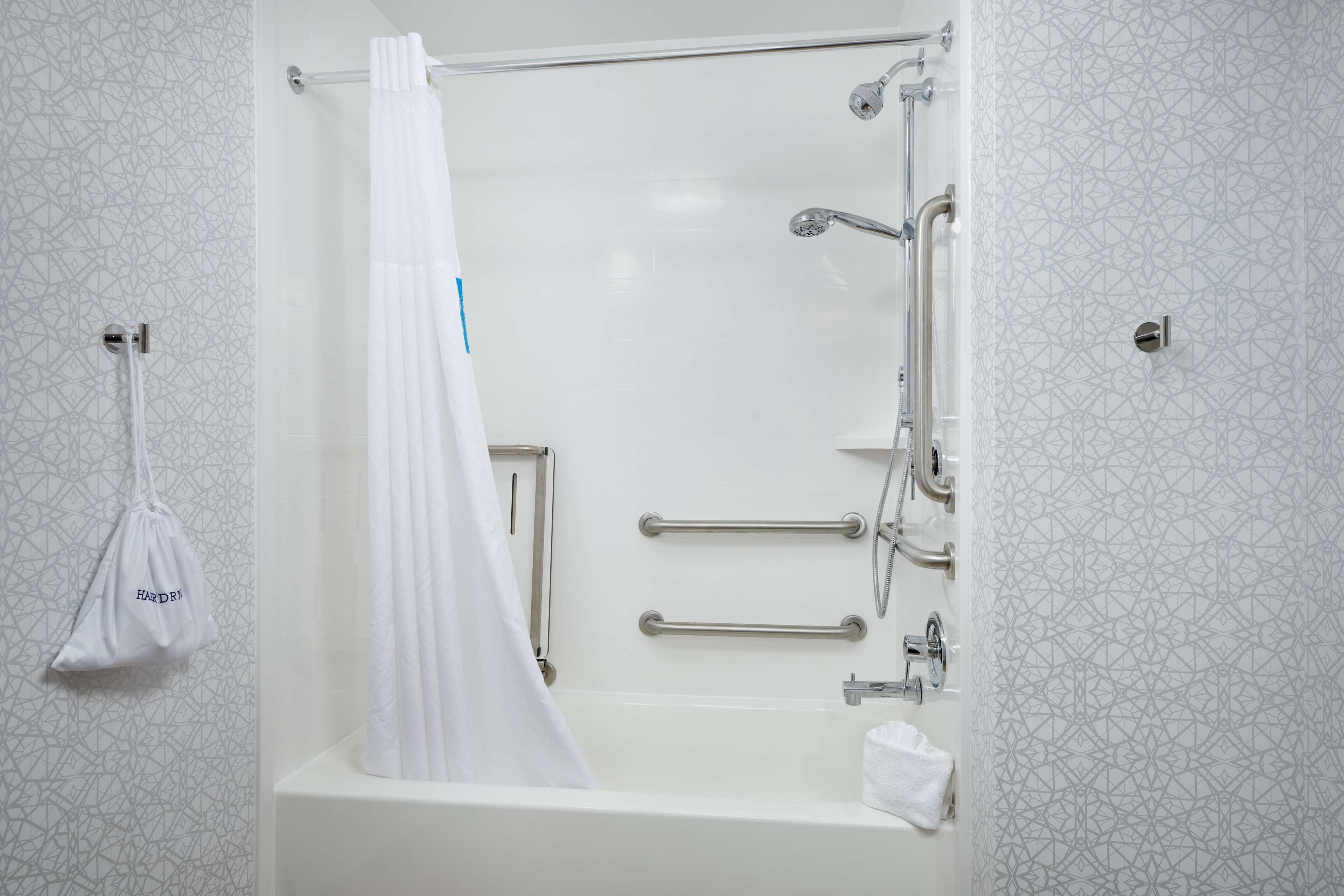 one king bed, non-smoking, accessible | bathroom | combined shower/bathtub, deep-soaking bathtub, free toiletries