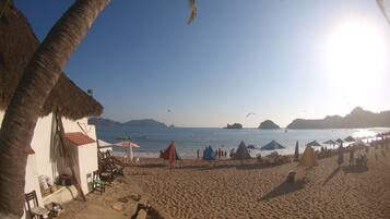 On the beach, sun loungers, beach umbrellas, beach towels