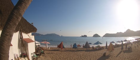 On the beach, sun-loungers, beach umbrellas, beach towels