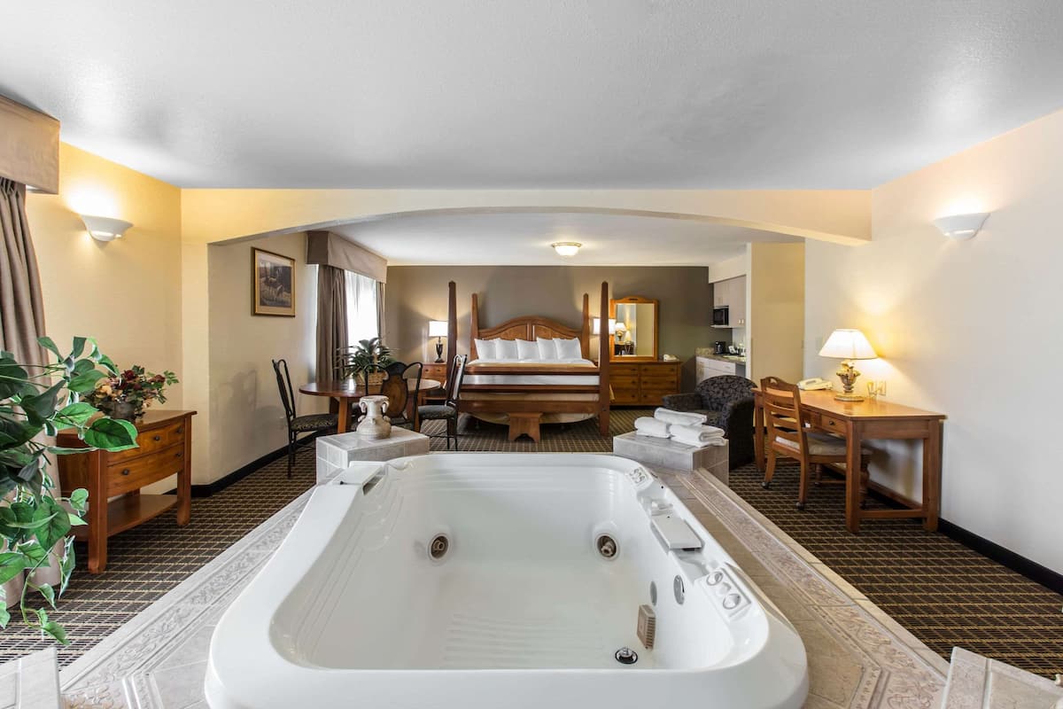 Suite, 1 King Bed, Non Smoking | Premium bedding, in-room safe, iron/ironing board, rollaway beds