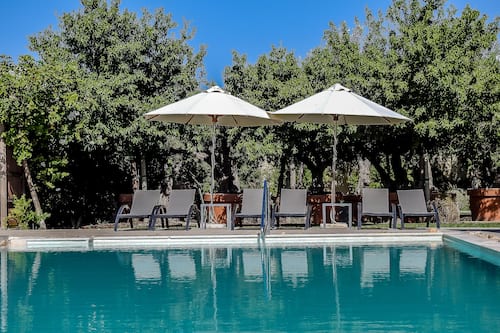 Seasonal outdoor pool, open 9 AM to 5 PM, pool umbrellas, sun loungers