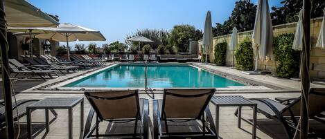 Seasonal outdoor pool, open 9 AM to 5 PM, pool umbrellas, sun loungers