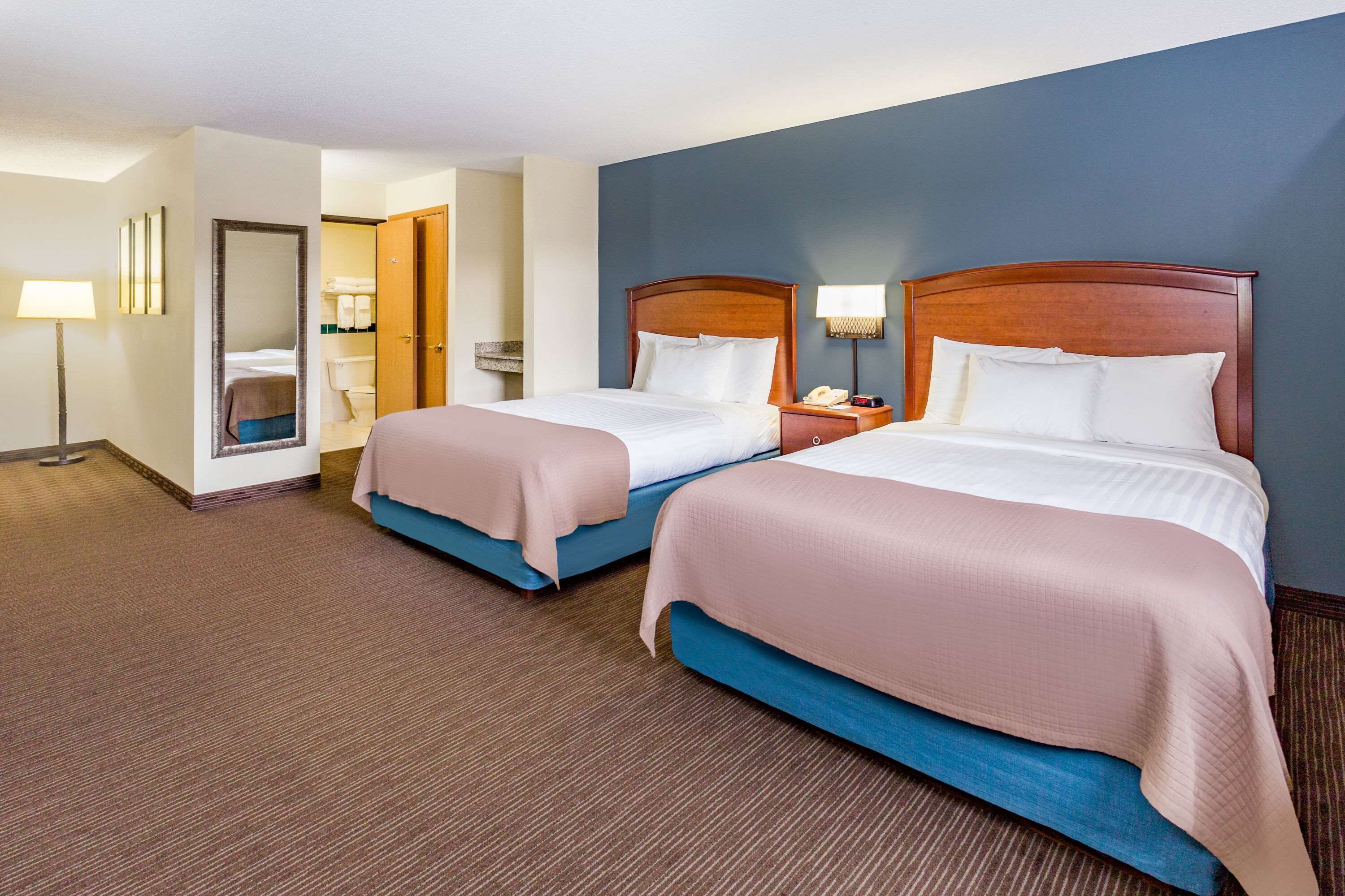 deluxe room, 2 queen beds, non smoking | desk, laptop workspace, blackout curtains, soundproofing