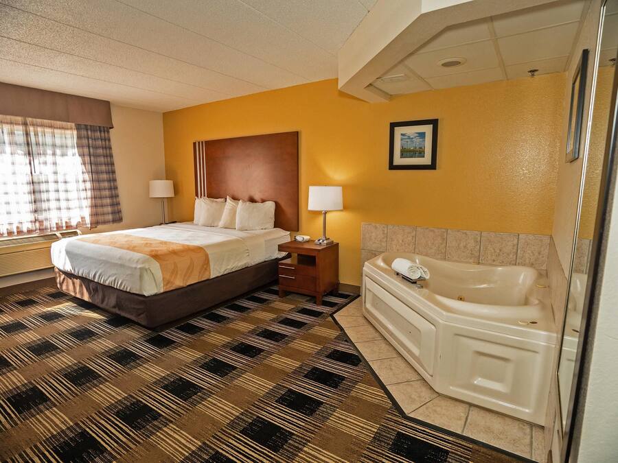 Suite, 1 King Bed, Non Smoking | Desk, laptop workspace, iron/ironing board, free wired Internet