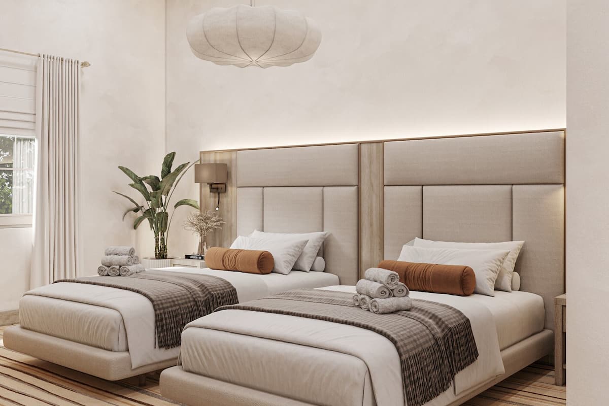 A modern hotel room with two beds, a large window with curtains, a hanging light fixture, and a striped carpet.