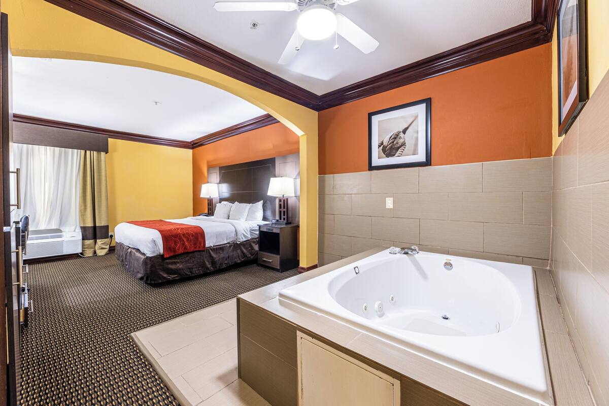 suite, 1 king bed, non smoking | in-room safe, desk, laptop workspace, iron/ironing board