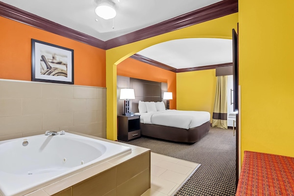Suite, 1 King Bed, Non Smoking | In-room safe, desk, laptop workspace, iron/ironing board
