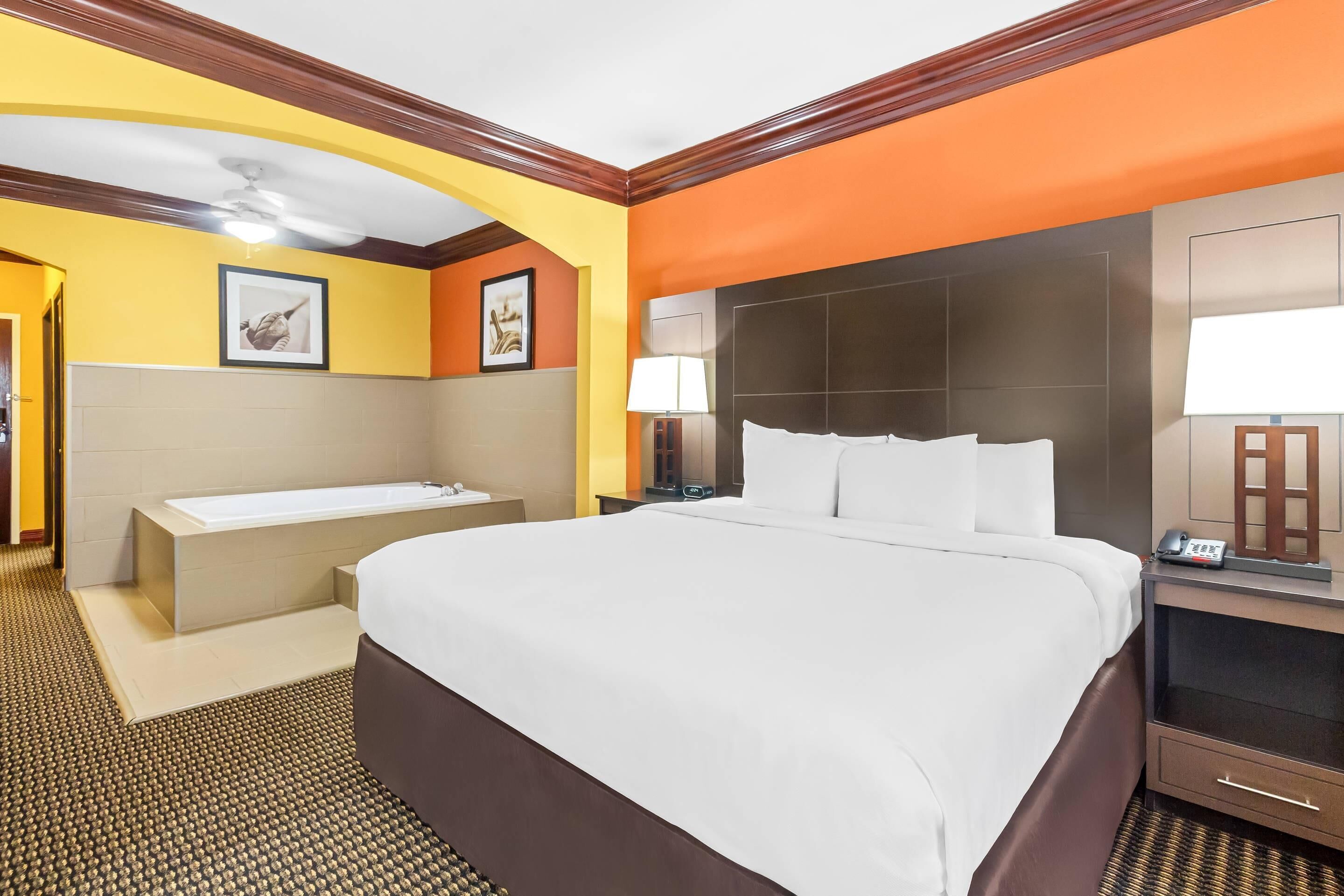 Suite, 1 King Bed, Non Smoking | In-room safe, desk, laptop workspace, iron/ironing board