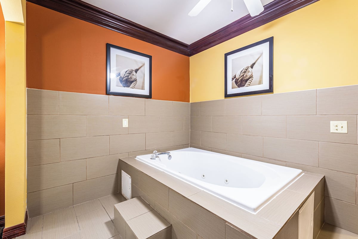 suite, 1 king bed, non smoking | in-room safe, desk, laptop workspace, iron/ironing board