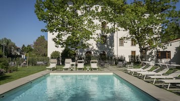 Seasonal outdoor pool, open 10:00 AM to 7:00 PM, pool umbrellas