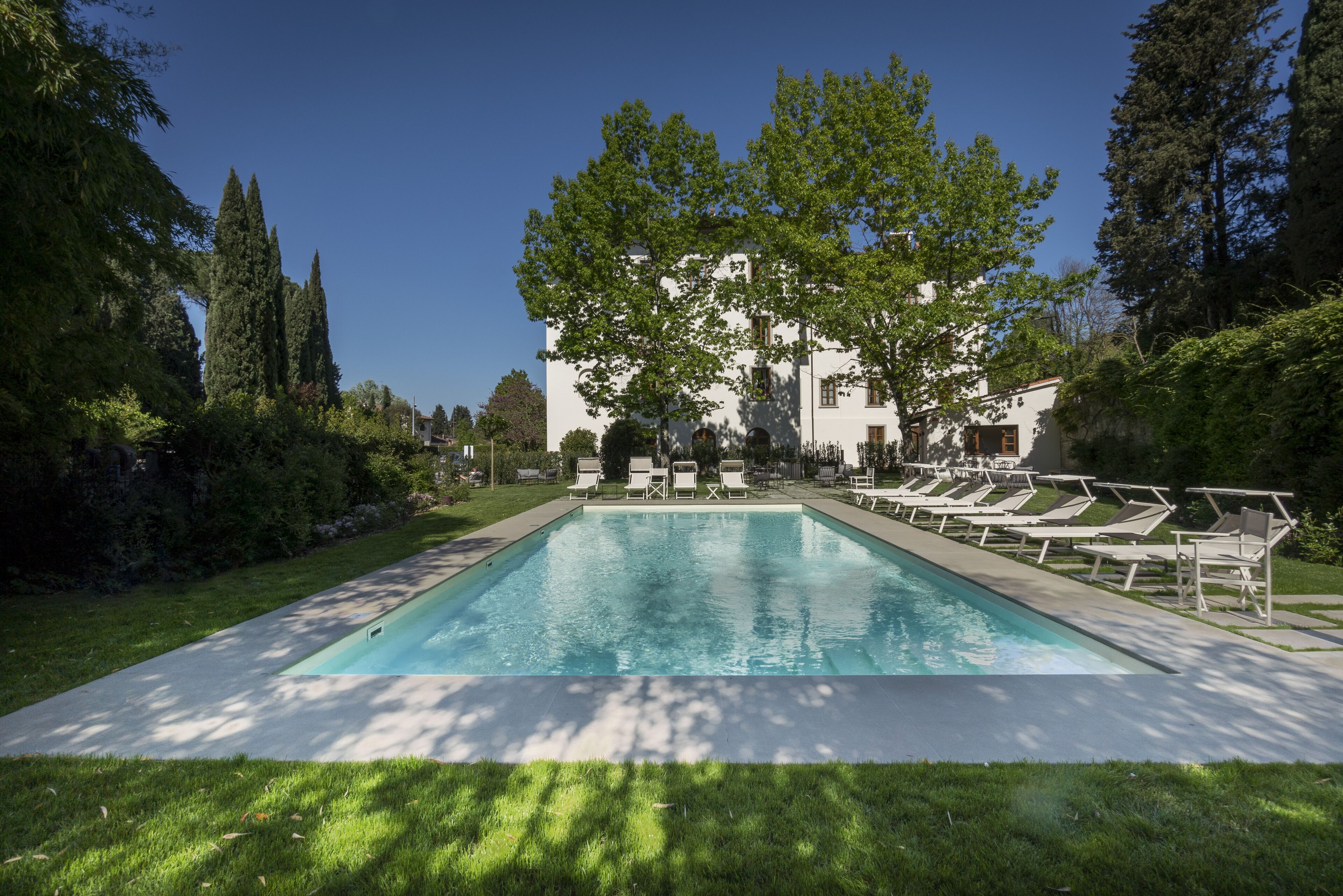 seasonal outdoor pool, open 10:00 am to 7:00 pm, pool umbrellas