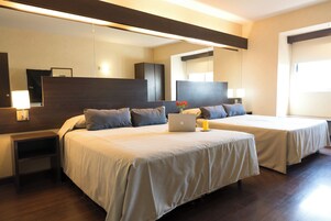 Standard Quadruple Room | In-room safe, individually decorated, individually furnished, desk