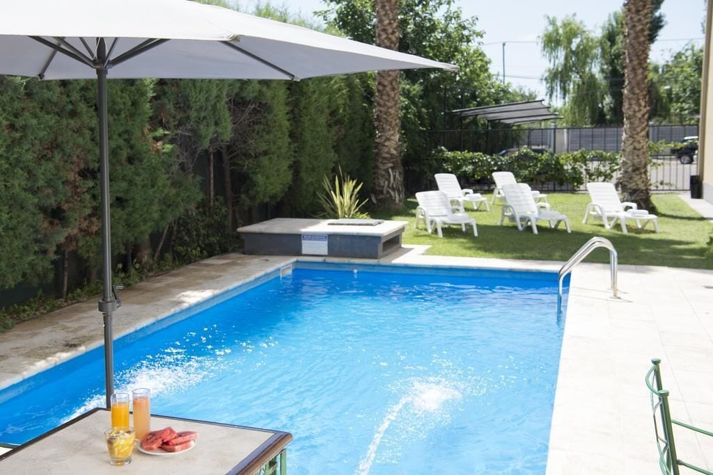 Seasonal outdoor pool, open 9:00 AM to 9:00 PM, pool umbrellas