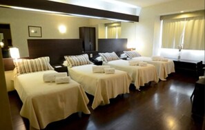 Standard Quadruple Room | In-room safe, individually decorated, individually furnished, desk