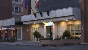 A hotel with a sign reading "City Hotel & Suites" and flags of the European Union and Italy. - City Hotel & Suites Foligno (Foligno)