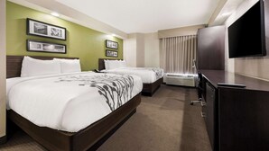 A hotel room with two beds, a flat-screen TV, and framed pictures on the wall. - Sleep Inn Athens I-65 (Athens)