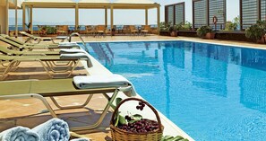 Seasonal outdoor pool, pool umbrellas, sun loungers