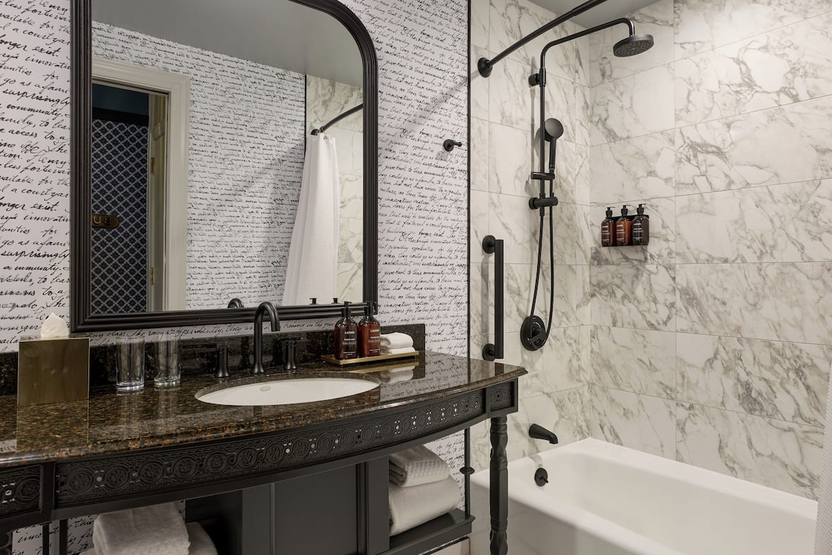 Combined shower/tub, designer toiletries, hair dryer, bathrobes