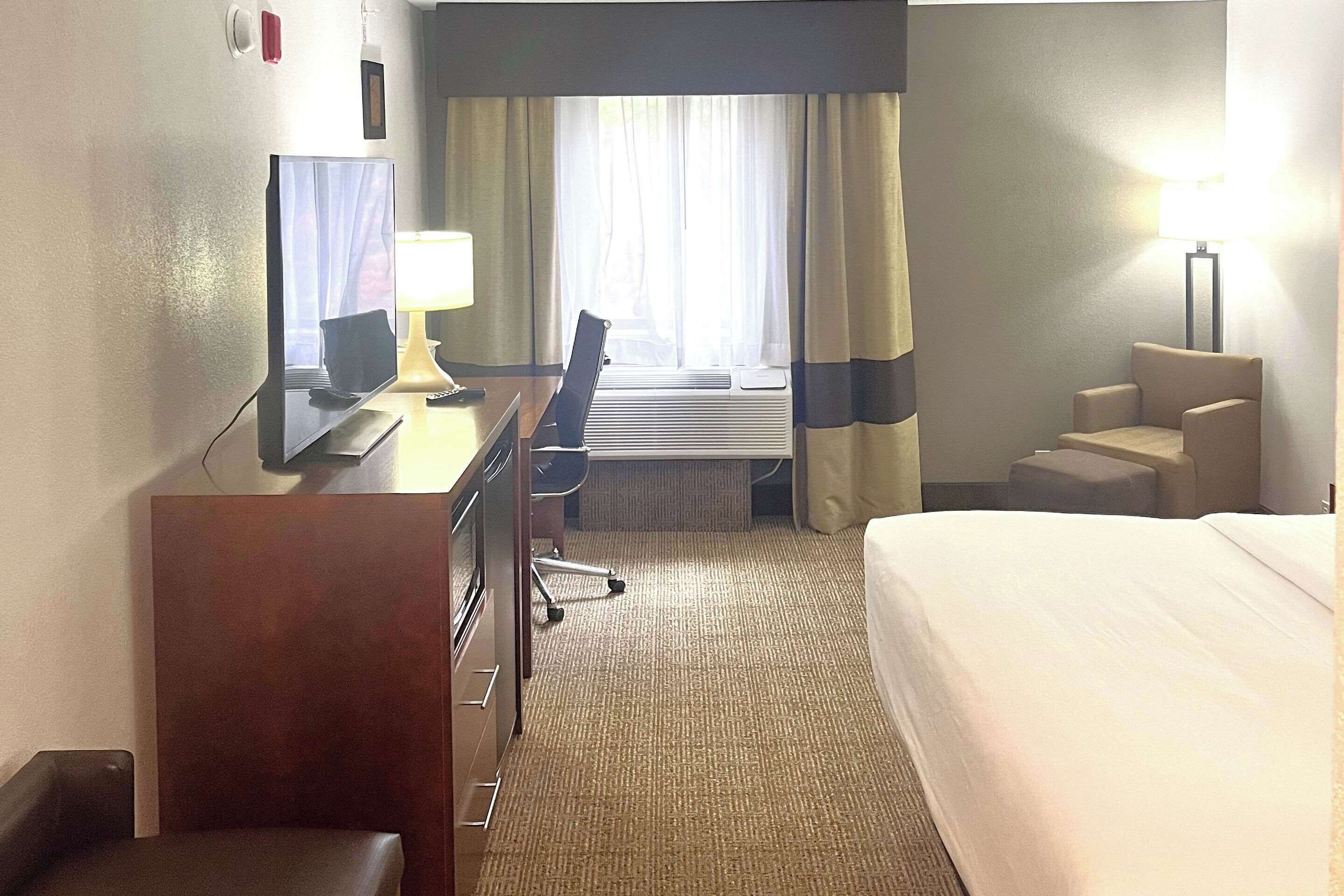 desk, laptop workspace, blackout curtains, iron/ironing board