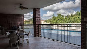 Outdoor pool, open 6:00 AM to 10:00 PM, pool loungers