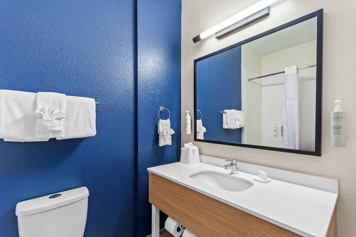 Room, 2 Queen Beds | Bathroom | Combined shower/bathtub, free toiletries, hair dryer, towels