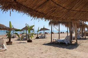 Private beach nearby, white sand, sun loungers, beach umbrellas