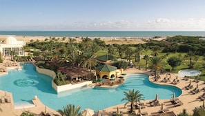 Indoor pool, outdoor pool, pool umbrellas, pool loungers