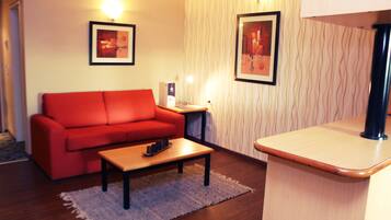 Suite | Living area | 21-inch LCD TV with cable channels, TV