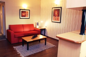 Suite | Living area | 21-inch LCD TV with cable channels, TV