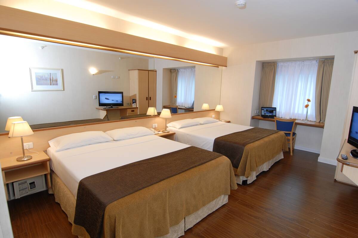 Classic Room, 2 Queen Beds | Minibar, in-room safe, desk, blackout curtains