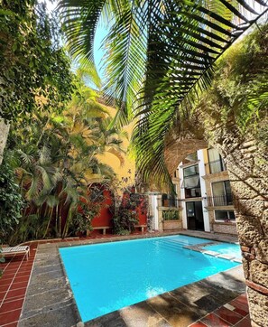 Outdoor pool, open 8:00 AM to 8:00 PM, sun loungers
