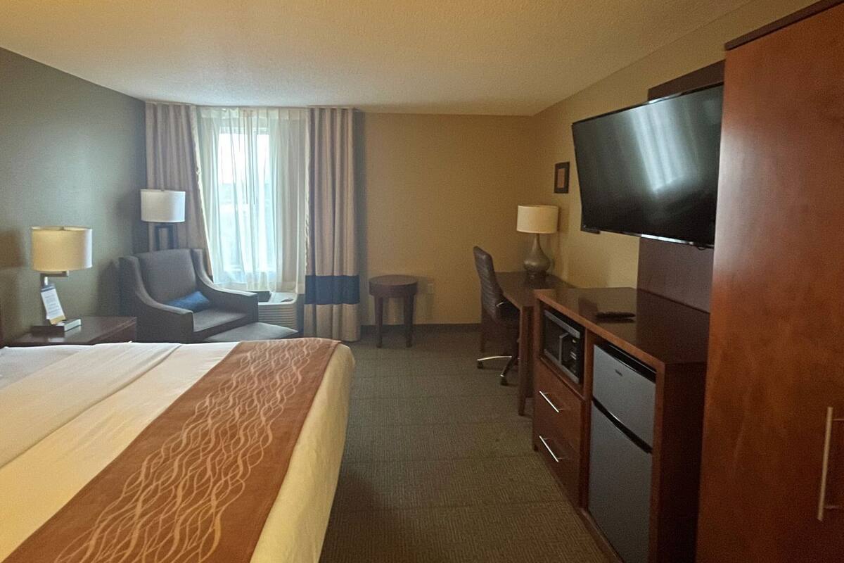 Desk, laptop workspace, blackout curtains, iron/ironing board