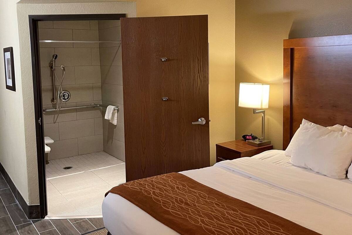 Desk, laptop workspace, blackout curtains, iron/ironing board