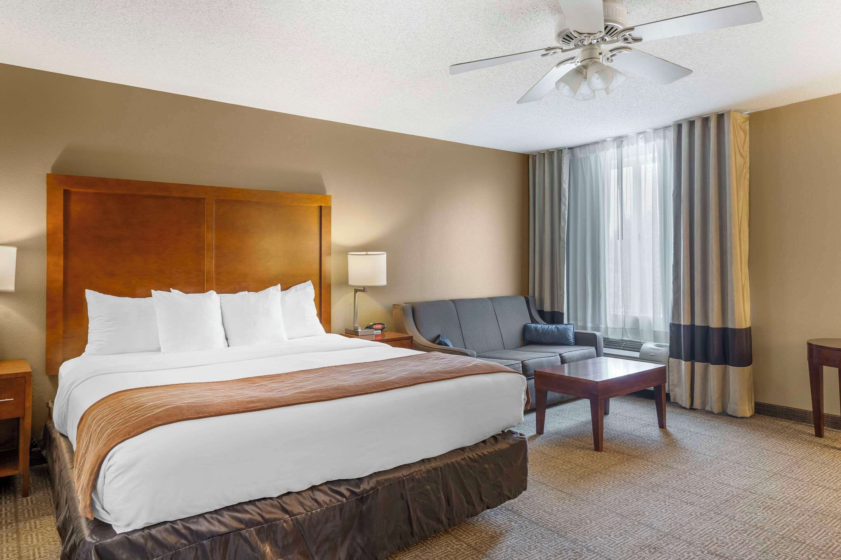 Desk, laptop workspace, blackout drapes, iron/ironing board