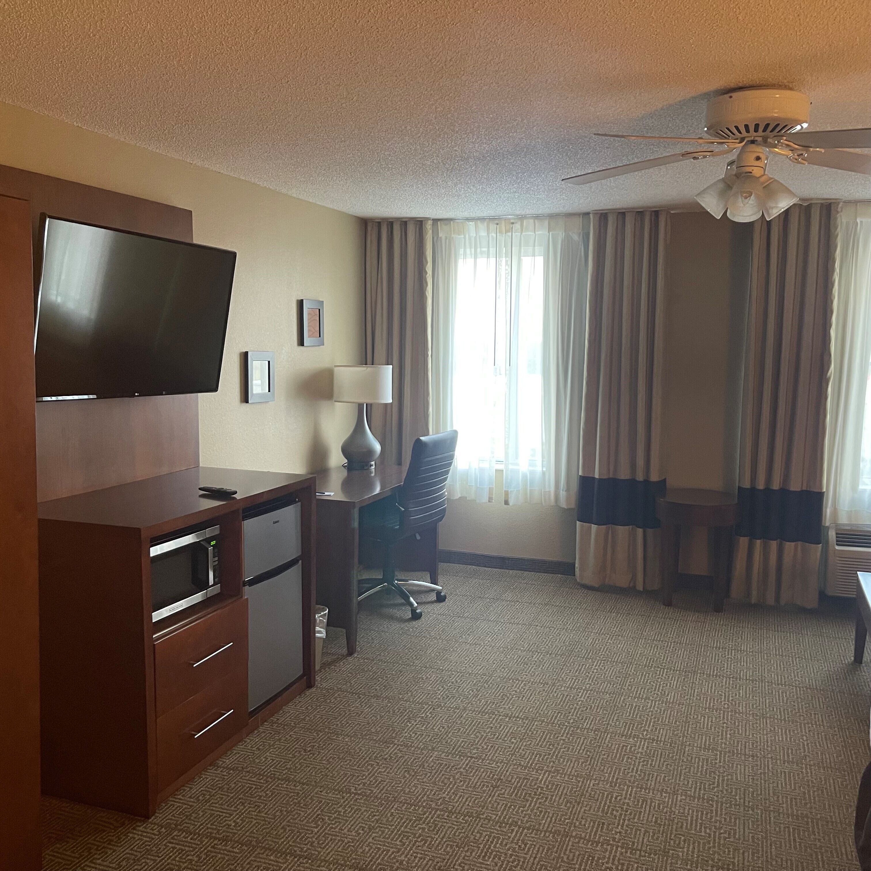 desk, laptop workspace, blackout curtains, iron/ironing board