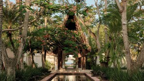 A serene garden with a central water feature, surrounded by lush greenery and a stone pathway. - Maroma, A Belmond Hotel, Riviera Maya (Playa del Carmen)