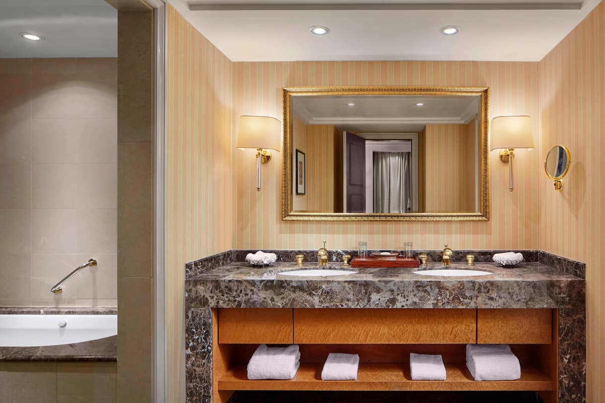 designer toiletries, hair dryer, bathrobes, slippers