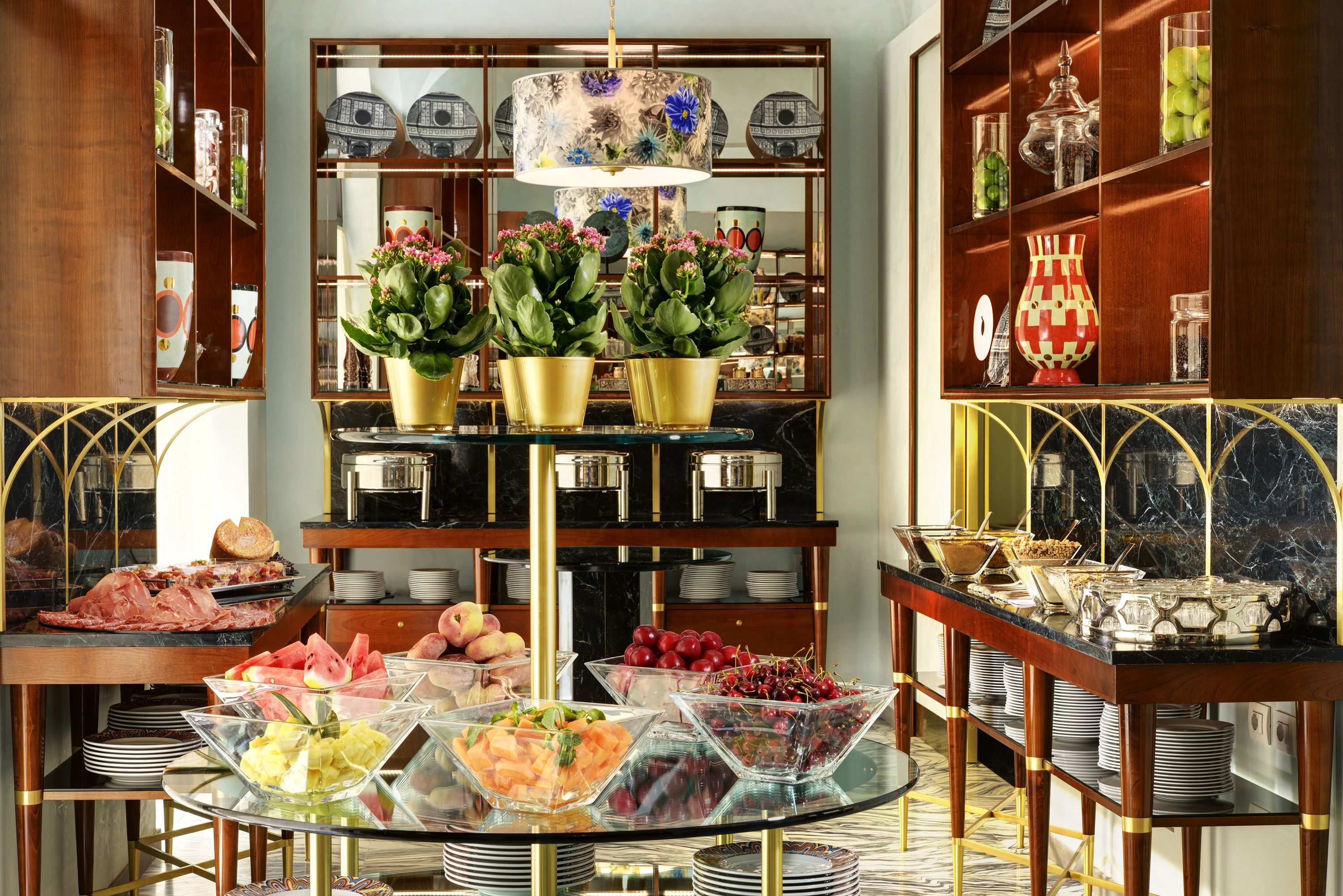 A buffet setup with various food items and decorative elements.