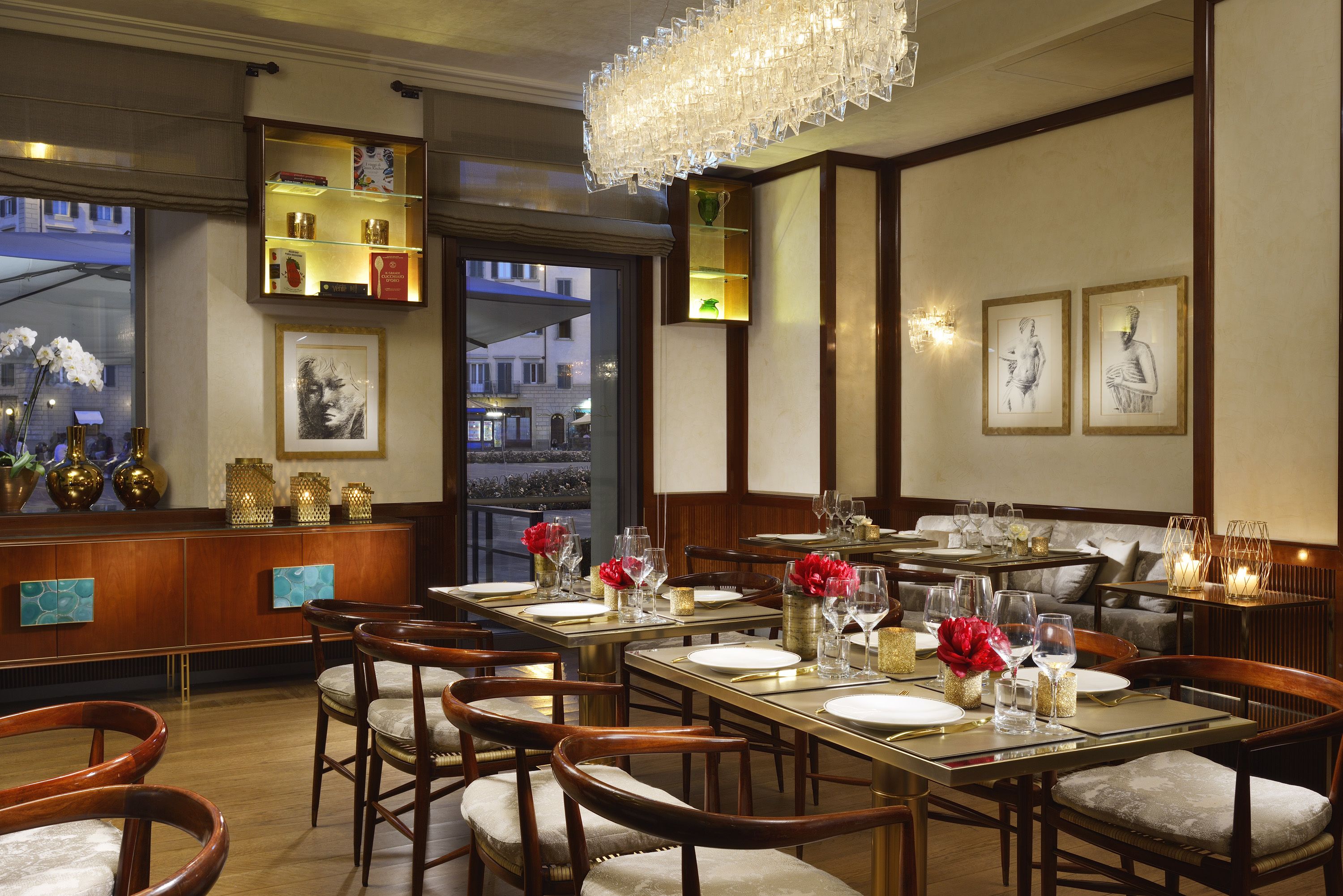 A restaurant with wooden furniture, glassware, and decorative elements.