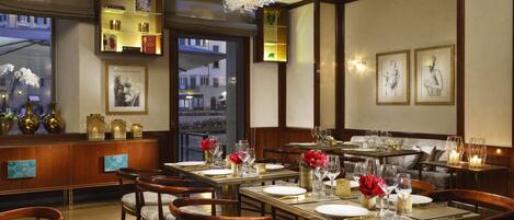 A restaurant with wooden furniture, glassware, and decorative elements.