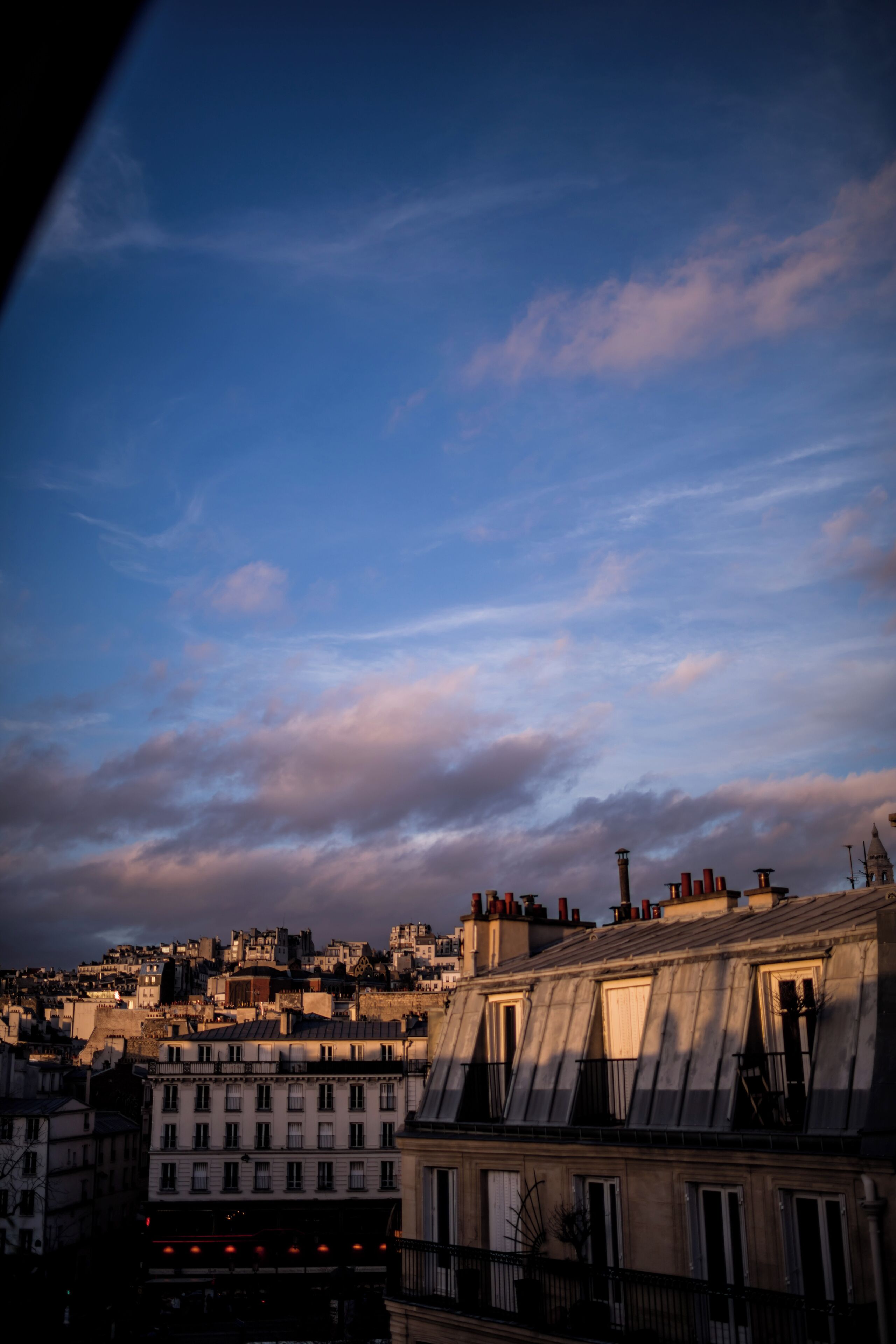 A cityscape with buildings and a clear sky.