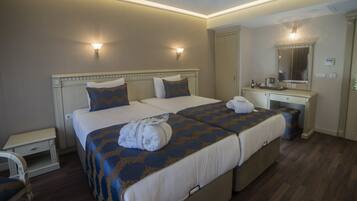 Premium bedding, down comforters, Select Comfort beds, minibar