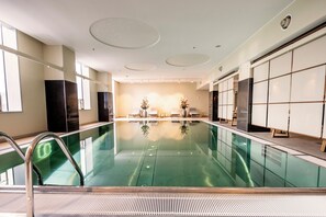 Indoor pool, open 6:00 AM to 10:00 PM, pool loungers