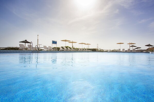 Indoor pool, outdoor pool, pool umbrellas, pool loungers
