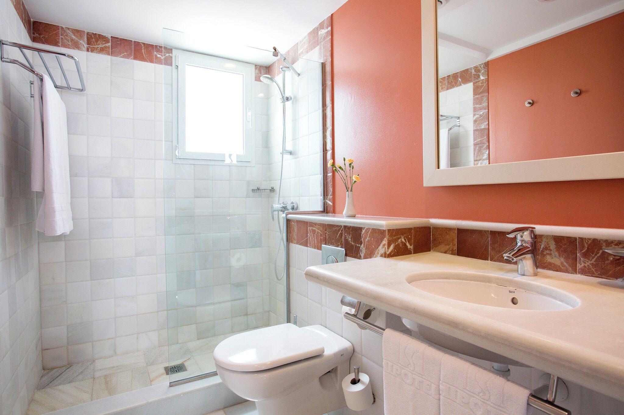 deep-soaking bathtub, eco-friendly toiletries, hair dryer, towels